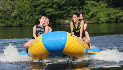 Campers on a banana boat.