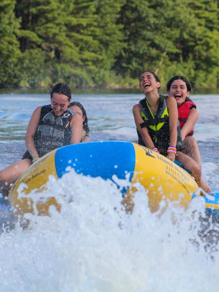 Campers on a banana boat.