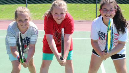 Campers ready to play tennis.